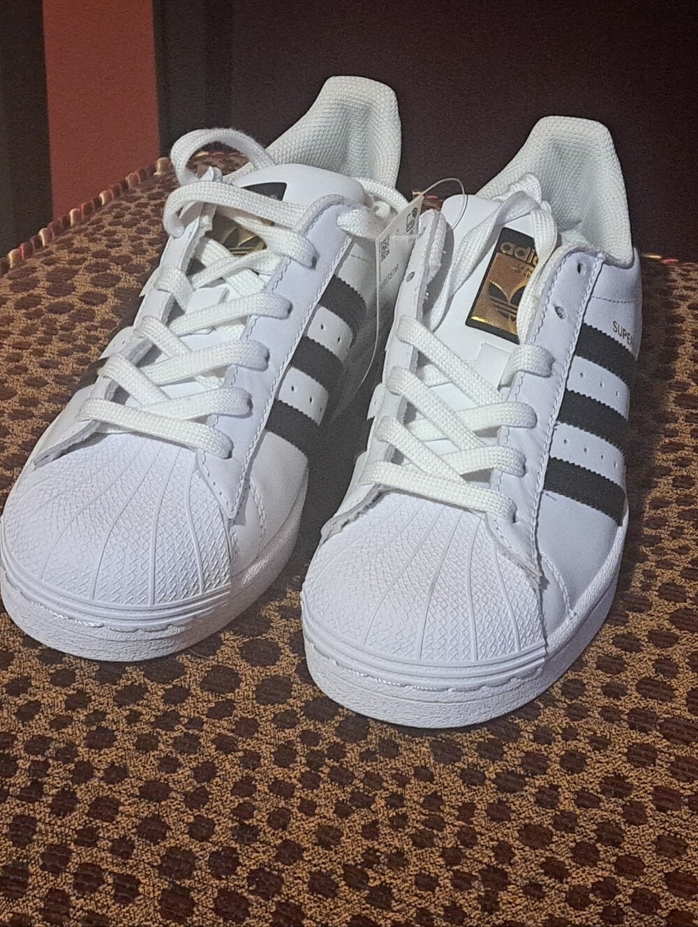 Adidas White Superstar Sneakers with Black Stripes And Gokd Tongue